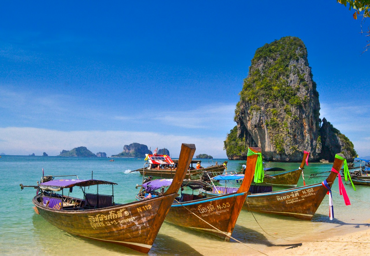 Railay Beach limestone cliffs and longtail boats